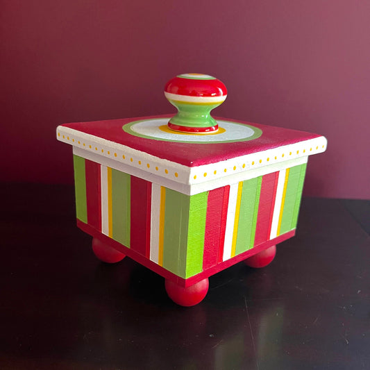 Calypso decorative handmade wooden box with red, green, white and yellow stripe details.
