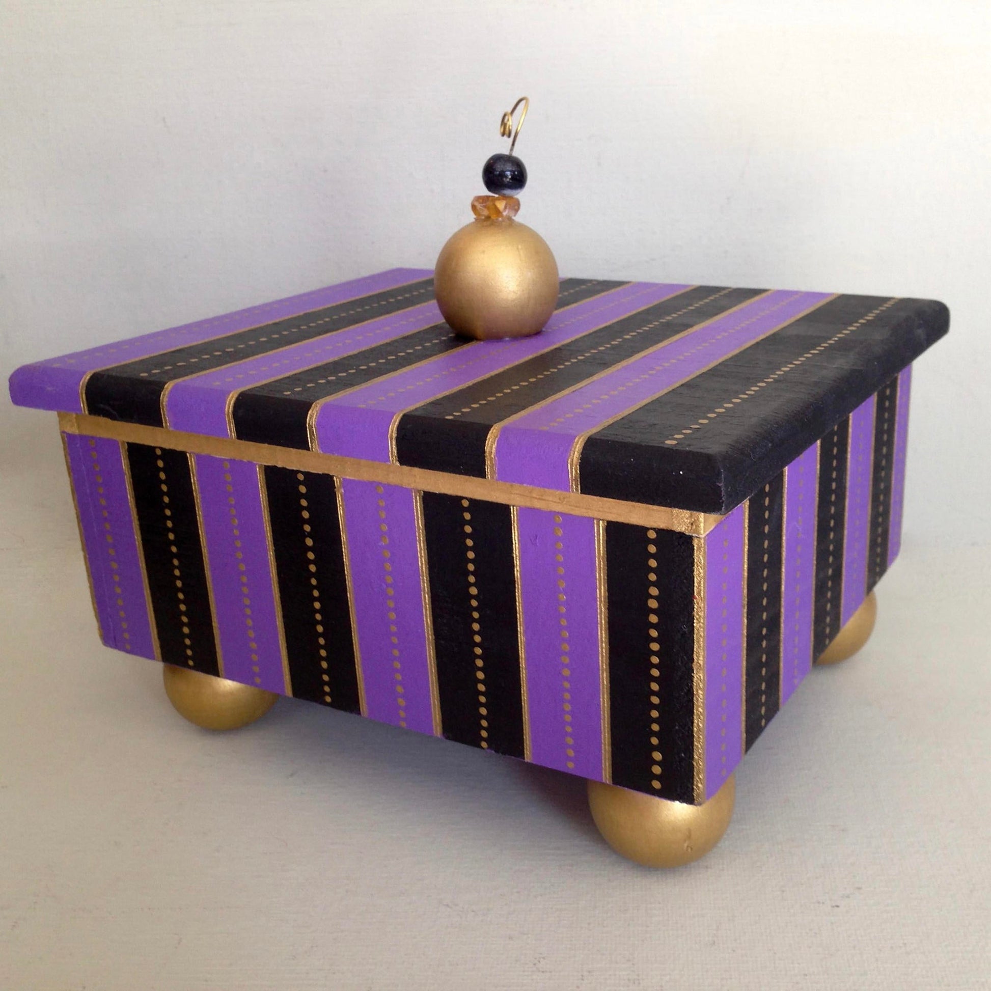 Waterloo decorative handmade wooden box with purple stripe details.