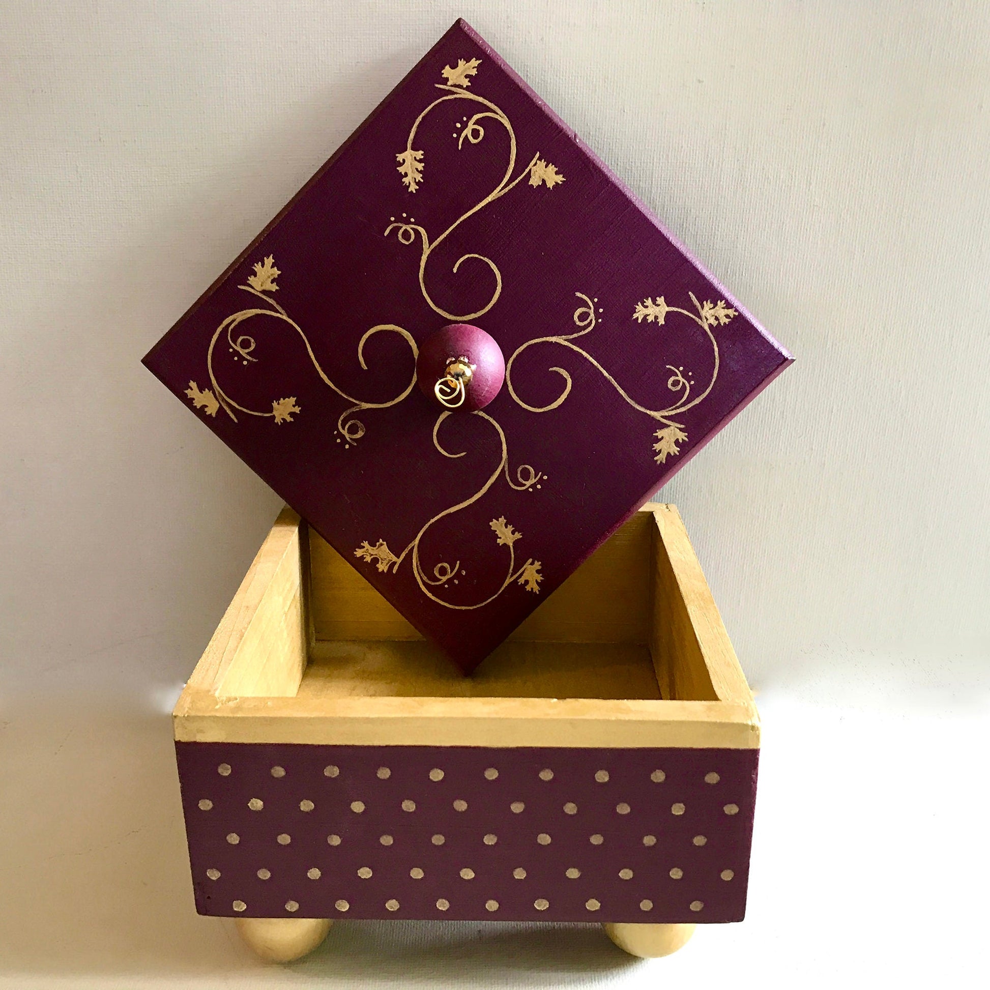 Gold leaf decorative handmade wooden box with metallic gold details showing lid and interior.